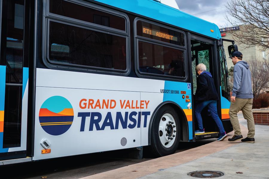 People boarding a Grand Valley Transit bus.