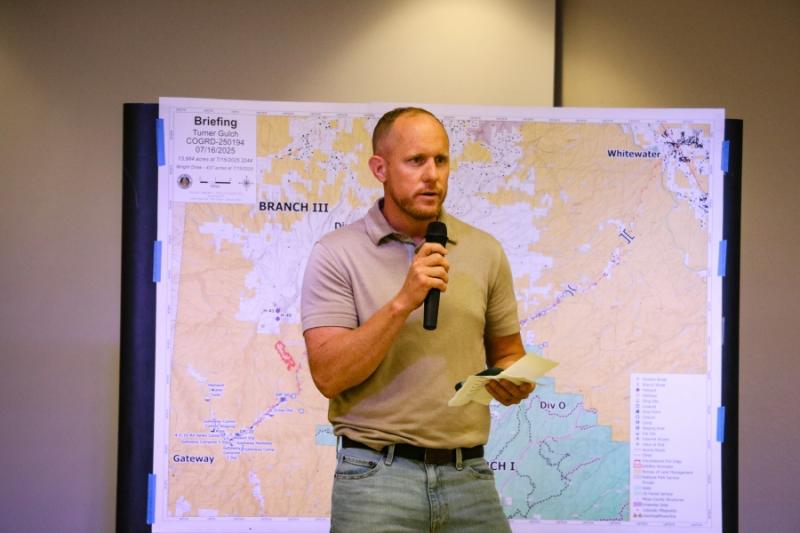 A man speaking into a microphone.