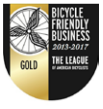 Wings in front of wheel stating Gold level Bicycle Friendly Business