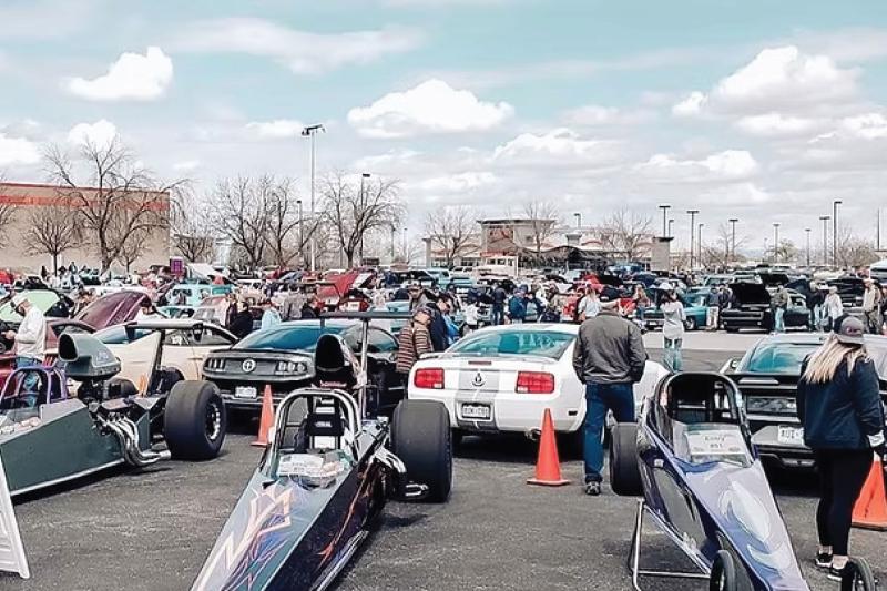 People looking at various cars during the Crime Stoppers of Mesa County Car Show