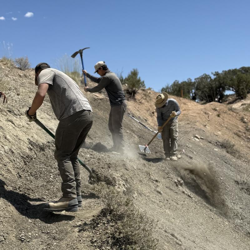 Three members of the trail crew are constructing trail at North Fruita Desert.