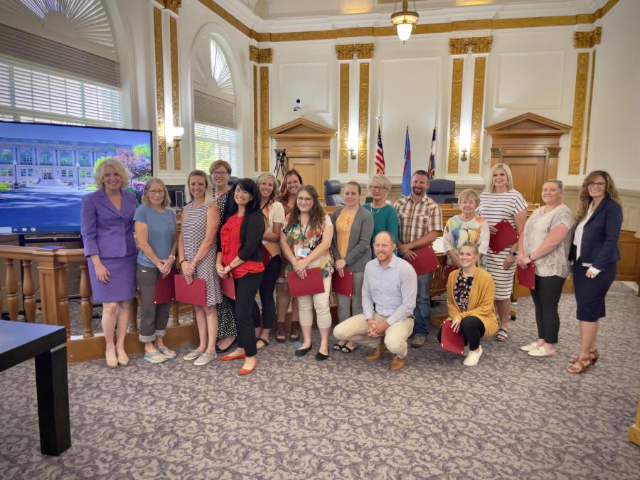 2023 Inside Mesa County graduates posing for a picture with the commissioners.