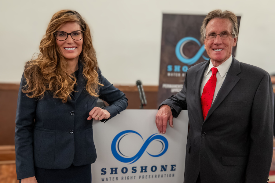 Mesa County Commissioner Bobbie Daniel and Colorado River District Board of Directors Member Scott McInnis at a podium 