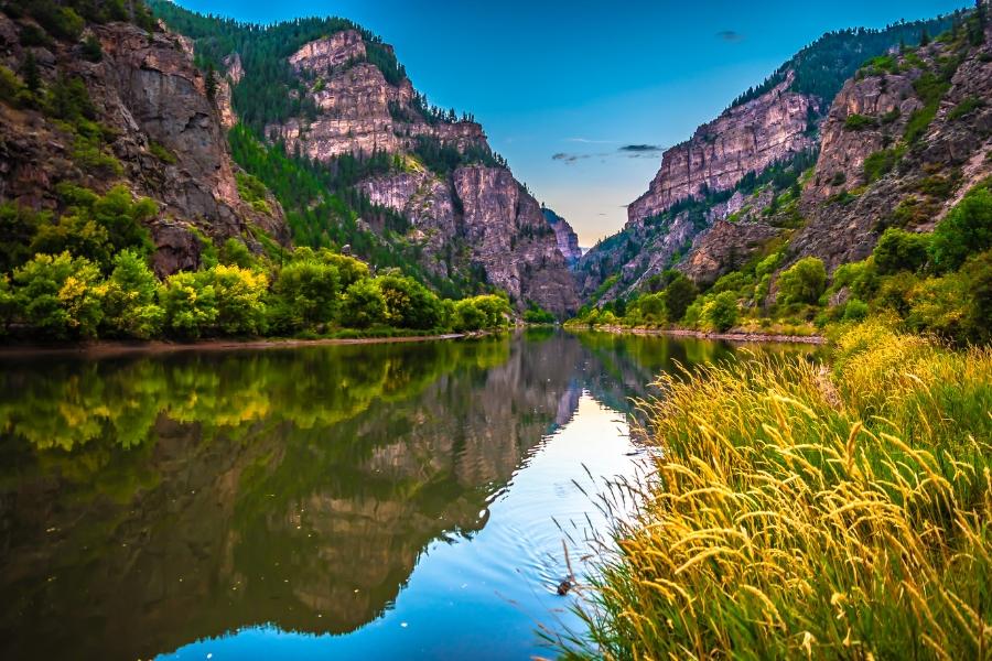 Colorado River with reflection of landscape in water. 