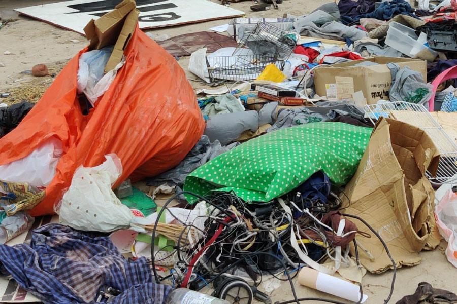 Variety of rubbish scattered on the ground.