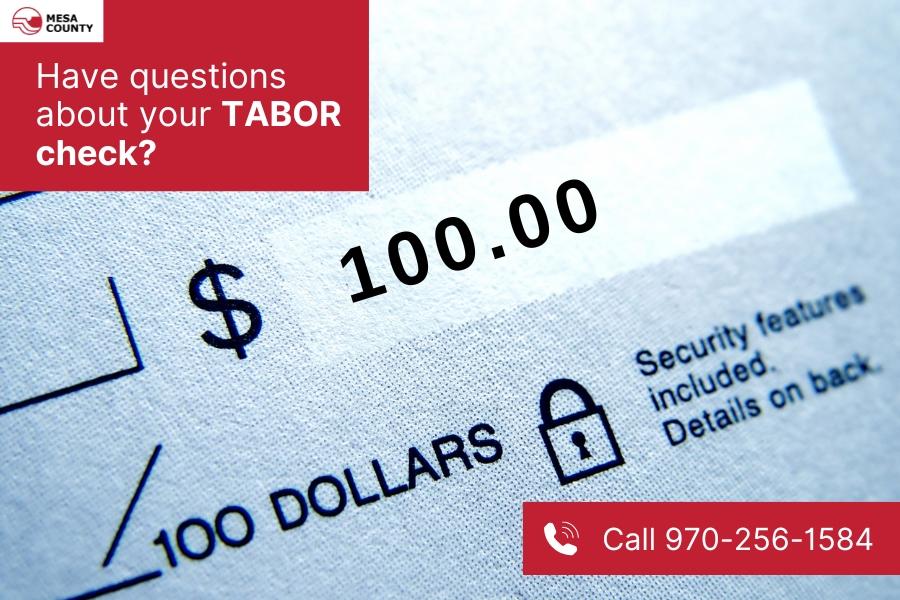 $100 check with red element on top left with white text reading, "Have questions about your TABOR check?" and the Mesa County logo, and red element on bottom right with white text reading, "Call 970-256-1584."