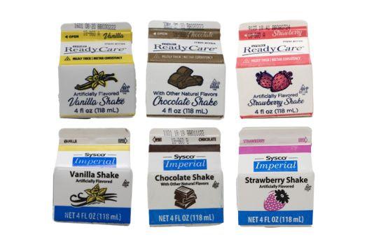 Three white, ReadyCare cartons of shakes, including vanilla, chocolate, and strawberry flavors, in addition to three white, Sysco Imperial cartons of shakes, including vanilla, chocolate, and strawberry flavors.