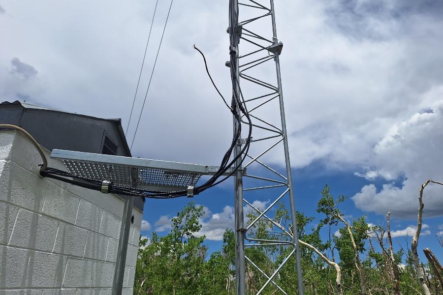 Antenna site with chord hanging down from lightning strike damage. 