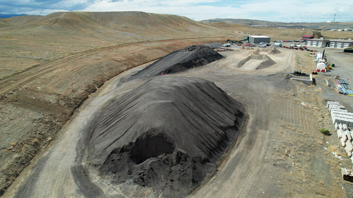 Pile of old asphalt for recycling.
