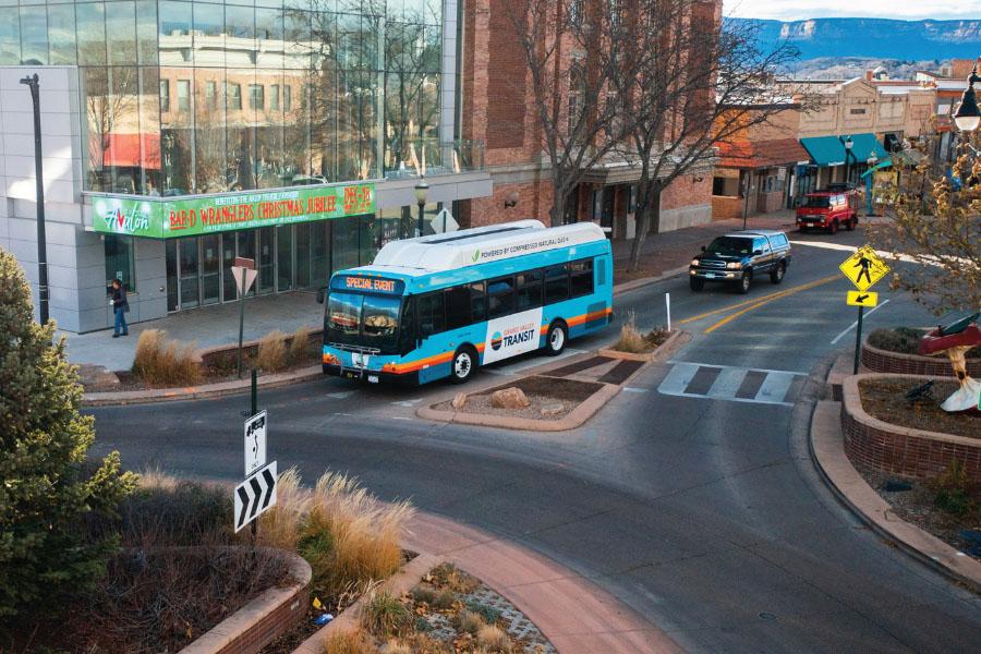 A Grand Valley Transit bus turns through a downtown roundabout near the Avalon Theatre in Grand Junction, Colorado. 
