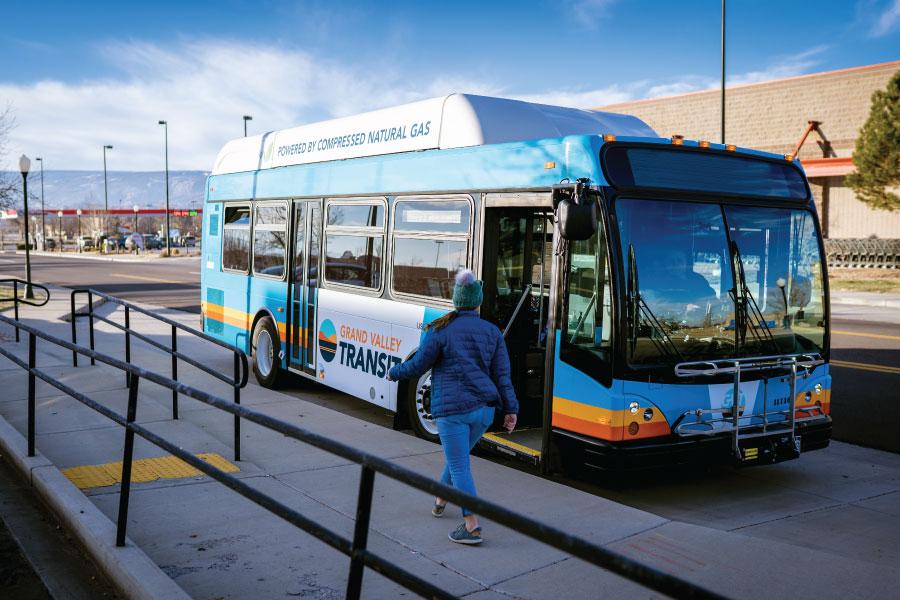 GVT bus with person walking by