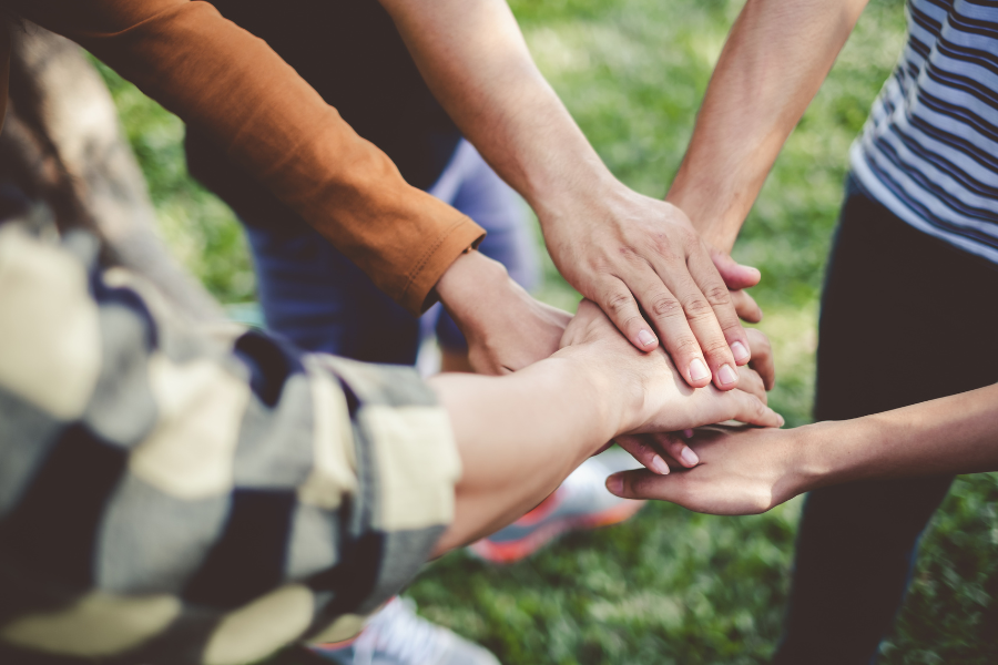 Volunteer group putting hands together