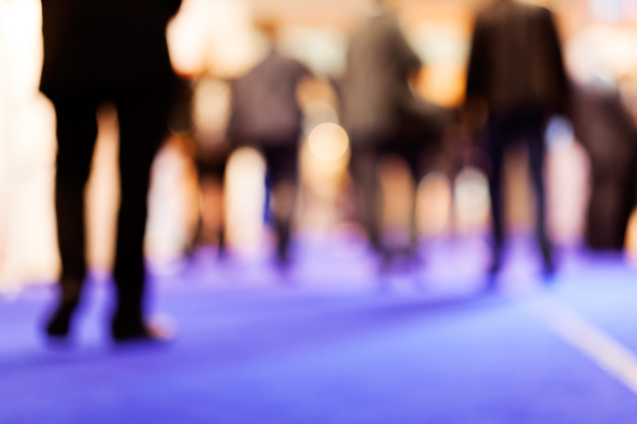 Blurred image of businesspeople walking.