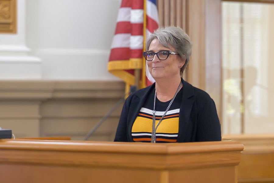 Sheila at lectern during public hearing