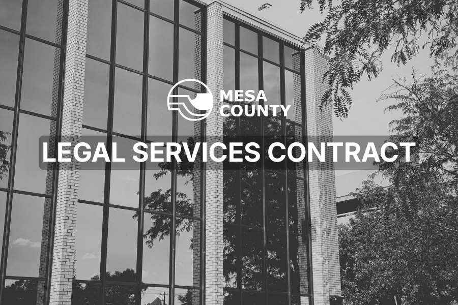 Black and white photo of the Old Mesa County Courthouse annex building with the county logo and the words “legal services contract.”
